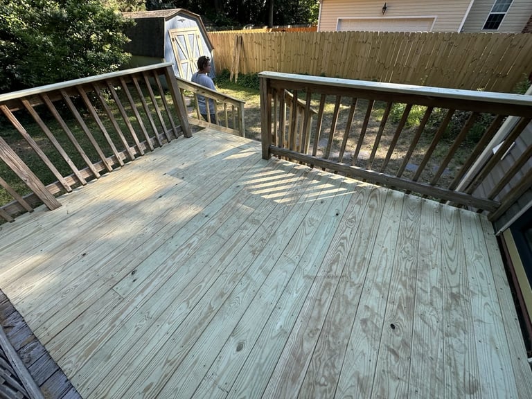 Large wooden deck replacement with railings overlooking a fenced backyard, Richmond VA area