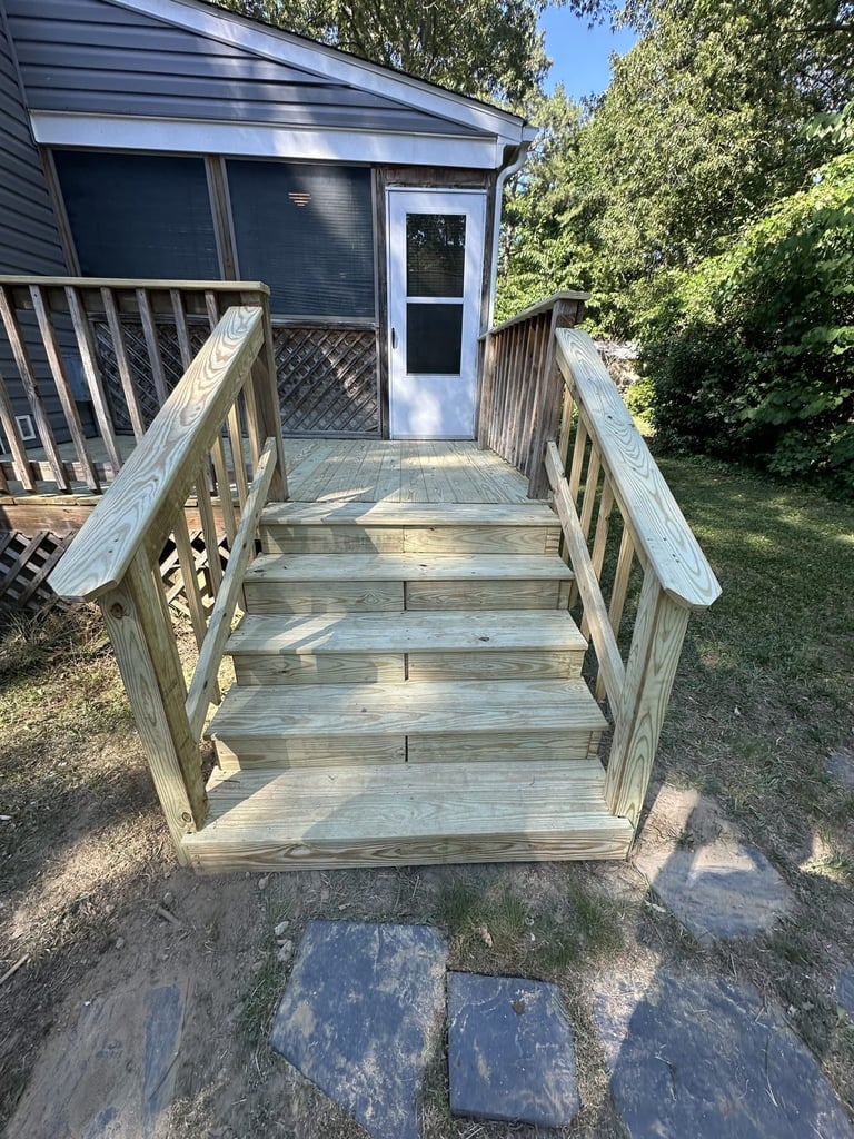 Pressure-treated deck with ramp and stairs leading to a home entrance, Richmond VA area
