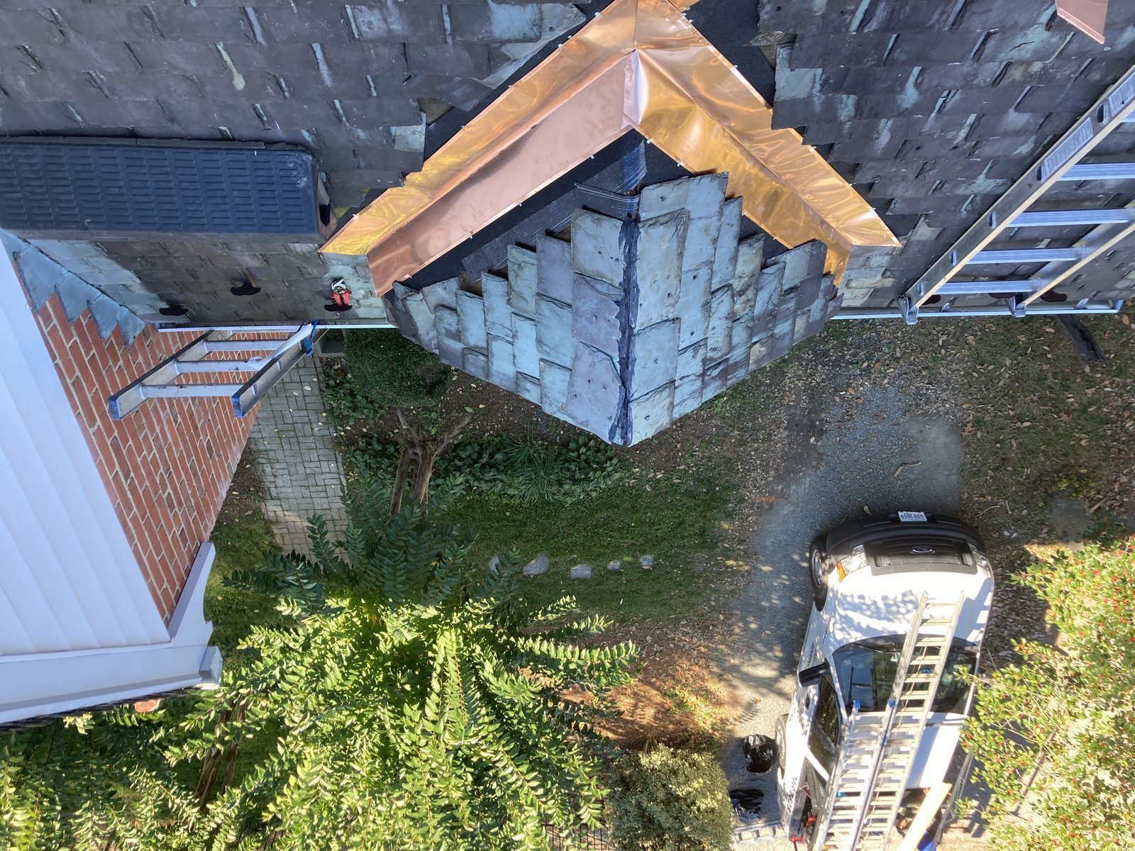 New copper flashing on a slate roof, seen from above, on a home in the Richmond, VA area