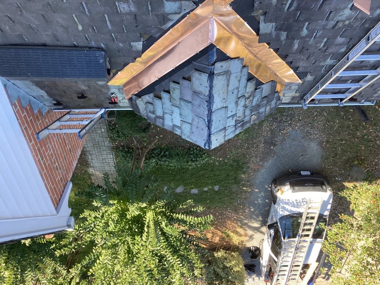 New copper flashing on a slate roof, seen from above, on a home in the Richmond, VA area